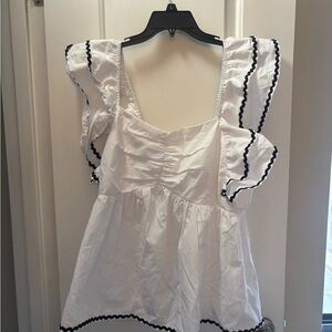 Chic White Blouse with Black Trim